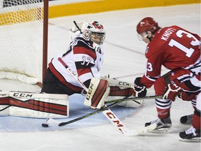 Ottawa 67's goalie Leo Lazarev (37) makes the stop on Niagara IceDogs Graham Knott (13) during the first period  in OHL hockey action Saturday March 26, 2016 at the Meridian Centre in St. Catharines.