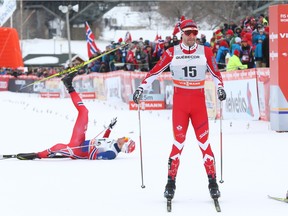Ola Vigen Hattestad (L) of Norway and Alex Harvey (15) of Canada cross the finish line of the quarterfinal in the 1.7km Sprint Free semifinals at the FIS Ski Tour Canada stop in Gatineau, March 01, 2016.