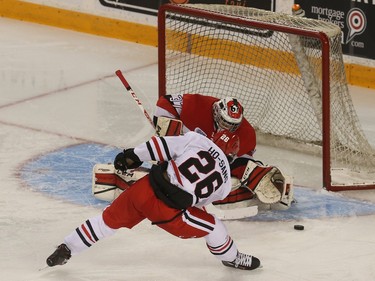 67s goalie Leo Lazarev makes a save against IceDogs Josh Ho-Sang during first period action.