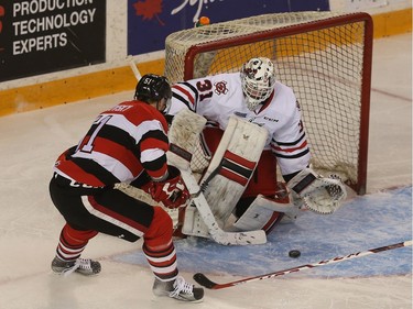 67s forward Stepan Falkovsky tries to score on IceDogs goalie Alex Nedeljkovic during first period action.