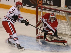 67s goalie Leo Lazarev makes a save against IceDogs Brendan Perlini during first period action.