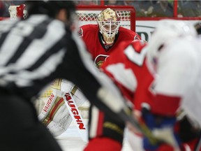 Senators goalie Andrew Hammond focuses on a faceoff during the second period.
