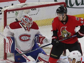 The Senators' Jean-Gabriel Pageau tries to tip the puck past Canadiens goalie Ben Scrivens during the first period at the Canadian Tire Centre on Saturday, March 20, 2016.