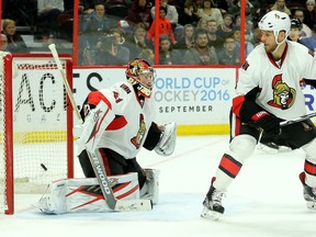 Ottawa's Marc Methot watches Anaheim's overtime goal by Rickard Rakell sail past goalie Craig Anderson to win 4-3 in overtime. Ottawa Senators vs. Anaheim Ducks at the Canadian Tire Centre Saturday (March 26, 2016) night.