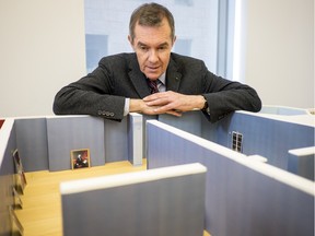 Paul Lang, chief curator at the National Gallery of Canada, poses by a diorama of the gallery space that will hold the first true international retrospective and first North American exhibition of Elisabeth Louise Vigée Le Brun (1755-1842): The Portraitist to Marie Antoinette.