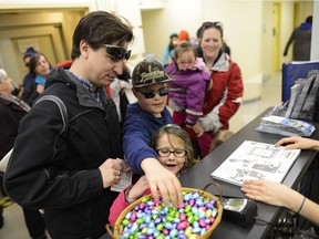 Paul Arbour and his family signs up for the annual Easter Egg Hunt at Diefenbunker on Saturday, March 26, 2016. (James Park)  NOTE: Boy is Joey (9) and girl in front of him is Anne (6)