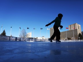 People skate on the Rink of Dreams at City Hall on Sunday, January 25, 2015.  (Cole Burston/Ottawa Citizen)