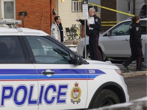 Police investigate the scene of a shooting near Old Richmond Road and Seyton Drive on Sunday, March 27, 2016.