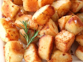 The Ultimate Crispy Garlicky Roast Potatoes are made with leftover chicken fat.