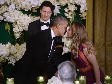 WASHINGTON, DC - MARCH 10: President Barack Obama and First Lady Sophie Trudeau of Canada greet each other as Prime Minister Justin Trudeau looks on during a State Dinner at the White House March 10, 2016 in Washington, D.C.