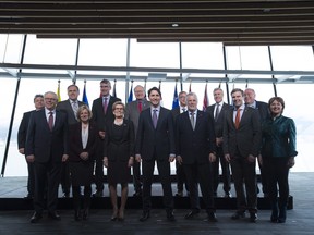 Prime Minister Justin Trudeau, centre, poses with Canada's premiers following the First Ministers Meeting in Vancouver, B.C., Thursday, March. 3, 2016.