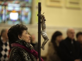 Raffaela Plastino was among the parishioners who came to observe the annual Good Friday way of the cross ceremony at St. Anthony's Church on Mar. 25, 2016. Priests carried a large wooden cross around the church, stopping for each of the 14 Stations of the Cross for a sermon, prayer and hymn.