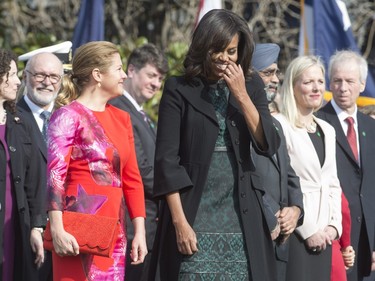 First lady Michelle Obama, right, and Sophie Gregoire-Trudeau share a laugh at a state arrival ceremony on the South Lawn of the White House in Washington, D.C., on Thursday, March 10, 2016.