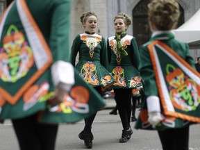FILE - In this March 17, 2015 file photo, girls perform a traditional Irish step dance as they march up Fifth Avenue during the St. Patrick's Day Parade in New York. The parade traces its history to 1762 and has about 200,000 marchers. (AP Photo/Mary Altaffer, File) ORG XMIT: NYR405
