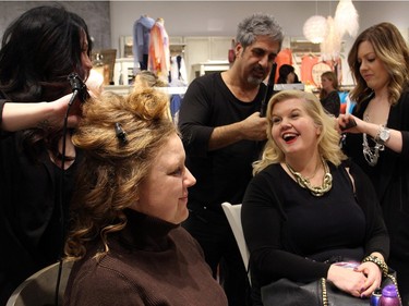 Sue McGarvie shares a laugh with stylist Krissy Julien while getting her hair done by Eli Saikaley and Caroline Fatica at a benefit held at Shepherd's store on Tuesday, March 1, 2016.