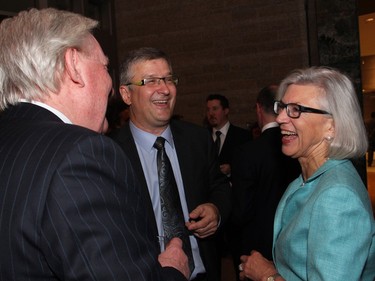 Supreme Court of Canada Chief Justice Beverley McLachlin enjoys a laugh with lawyers Greg Kane, left, and Randy Marusyk, at Ottawa City Hall.