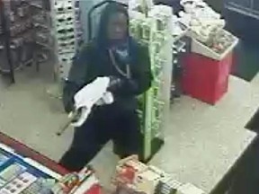Suspect with a long gun in a Convenience store stickup March 12.