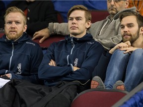 Swedish curlers taking in the action Niklas Edin, (from left) Christoffer Sundgren and Oskar Eriksson as the Tim Horton's Brier continues on Sunday at TD Place in Ottawa.