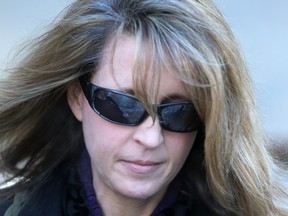 Ottawa teacher's aide Kathy Kitts leaves the courthouse in Ottawa in March.