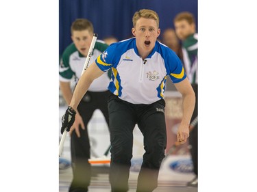Team Alberta player Marc Kennedy shouts while playing PEI as the Tim Horton's Brier continues on Sunday at TD Place in Ottawa.