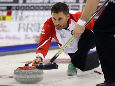 Team Canada Third John Morris throws his stone during his match against Team Quebec at the Tim Hortons Brier at TD Place in Ottawa, March 05, 2016.