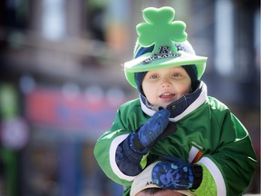 Three year old Declan O'Flaherty is full of Irish spirit perched on his dad's shoulders with all his green as he gets ready to watch the 34th annual St Patrick's Parade Saturday.