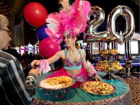 The Casino du Lac Leamy is celebrating its 20th anniversary in style by having colourful characters handing out 4000 sweet macarons to customers. Thursday March 24, 2016. Errol McGihon