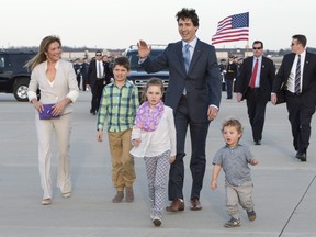 Prime Minister Justin Trudeau arrives for a state visit with his wife Sophie Gregoire-Trudeau, left, and their children Xavier James, Ella-Grace and Hadrian, right, at Andrews Air Force Base, Md., Wednesday, March 9, 2016. THE CANADIAN PRESS/Paul Chiasson ORG XMIT: PCH503
