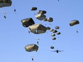 U.S. Army paratroopers assigned to the 2nd Battalion,, 503rd Infantry Regiment, 173rd Airborne Brigade, exit a U.S. Air Force 86th Air Wing C-130 Hercules aircraft at Juliet Drop Zone in Pordenone, Italy, Feb. 18, 2016. The 173rd Airborne Brigade is the U.S. Army Contingency Response Force in Europe, capable of projecting ready forces anywhere in the U.S. European, Africa or Central Commands areas of responsibility within 18 hours. (U.S. Army Photo by Visual Information Specialist Massimo Bovo/Released)