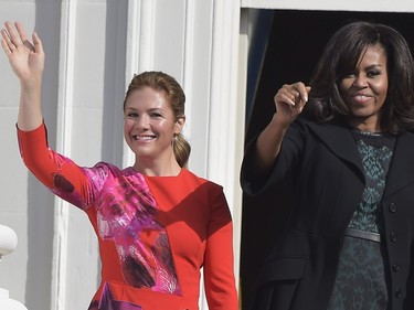 Sophie Grégoire-Trudeau (L), the wife of Canada's Prime Minister Justin Trudeau, and US First Lady Michelle Obama  wave during a welcome ceremony during a State Visit on the South Lawn of the White House on March 10, 2016 in Washington, DC. /