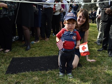 A boy holds Canadian and US flags during the arrival ceremony for Canadian Prime Minister Justin Trudeau at the White House in Washington, DC, on March 10, 2016. /