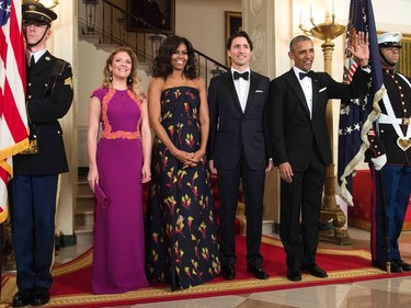 From left Sophie Gregoire-Trudeau, US first lady Michelle Obama, Canadian Prime Minister Justin Trudeau and US President Barack Obama pose for a photo before a state dinner at the White House March 10, 2016 in Washington. /