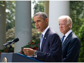 U.S. President Barack Obama speaks on Syria in the Rose Garden at the White House in Washington on Aug. 31, 2013 as Vice-President Joe Biden looks on.