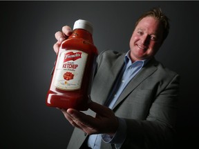 Taras Natyshak, MPP Essex, is photographed with a bottle of French's ketchup.