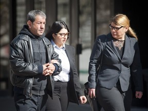 From left to right, Behnam Yaali's  father, sister and lawyer were at the Elgin Street courthouse Saturday morning when Yaali was charged with second-degree murder in the shooting death of his former girlfriend, Christina Voelzing.