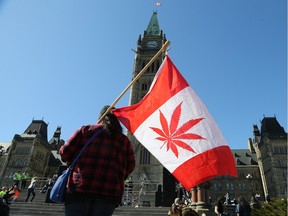 A number of marijuana flags were present as the annual marijuana smoke-up took place on Parliament Hill with more than a couple thousand taking part. (WAYNE CUDDINGTON) Assignment - 123462