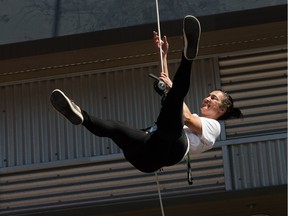 Aeriosa vertical dancer Julia Taffe performs on the outside of Mountain Equipment Co-op during the press conference held for WESTBORO FUSE which takes place June 10-12, 2016.