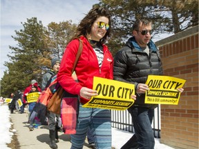 People gathered to walk on Jasmine Crescent in the city's east end earlier this year n support of their community, which has been struck by violence in the past year.