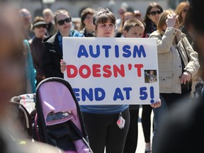 A large group of supporters gathered on Parliament Hill to support Autism on the Hill in Ottawa Tuesday April 19, 2016. Autism on the Hill is a national public rally held on Parliament Hill to promote autism awareness and to show support for Canadian people and families affected by autism. Ashley Falsetto attending the rally in support of her three year old daughter.