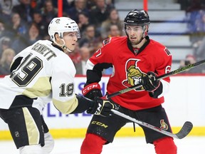 Ben Harpur of the Ottawa Senators defends against Beau Bennett of the Pittsburgh Penguins during second period of NHL action at Canadian Tire Centre in Ottawa, April 05, 2016.