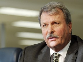 Carleton-Mississippi Mills MPP Jack MacLaren, left, speaks with reporters at the Ottawa Citizen's national bureau on Friday, January 16, 2015.