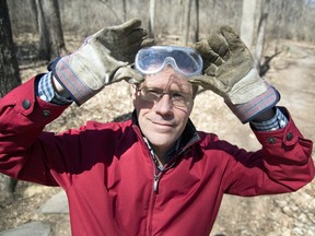 Citizen reporter Tom Spears dons protective gear – including boots, gloves and goggles – before setting out in nature.