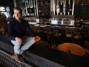 P.J. L'Heureux, president of Craft Beer Market, poses in their new store at Lansdowne Park Wednesday. The new Craft Beer Market is to open in May.