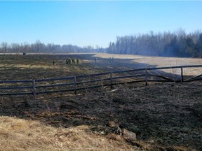 Ottawa firefighters were on the scene of a brush fire in a rural area west of Ottawa on Tuesday that expanded to cover more than two acres in size.