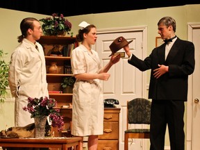 Dr. Sanderson played by Jacob McQuillan (L), Nurse Kelly played by Kayla Lalonde (2ndFL), and Dr. Chumley played by Scott McGlashan (R), during St. Patrick's High School's Cappies production of Harvey.