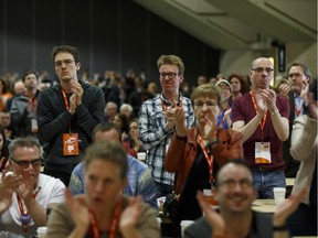 Delegates applaud as Alberta Premier Rachel Notley speaks at the Edmonton 2016 NDP national convention at Shaw Conference Centre in Edmonton, Alta., on Saturday April 9.