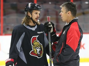 Erik Karlsson (L) of the Ottawa Senators chats with Dave Cameron during morning practice at Canadian Tire Centre, October 01, 2015. (Jean Levac/ Ottawa Citizen)