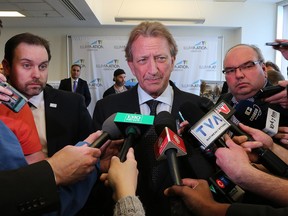 Eugene Melnyk, owner of the Ottawa Senators and head of the RendezVous LeBreton proposal is scrummed by the media following the NCC's board of directors announcement that his plan was selected for development of LeBreton Flats. Now, there's some talk of public money helping pay for a new arena. That talk should stop, says Tyler Dawson.