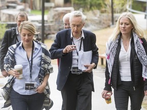 Sir Michael Barber, the guru of what's called deliverology, is flanked by Heritage Minister Mélanie Joly (L) and Environment Minister Catherine McKenna as they head to a cabinet retreat in Kananaskis on April 26.