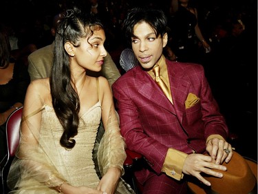 Musician Prince has reportedly Died at 57 on April 21, 2016. HOLLYWOOD, CA - MARCH 6:  Singer Prince (R) and his wife Manuela Testolini sit in the audience at the 35th Annual NAACP Image Awards held at the Universal Amphitheatre, March 6, 2004 in Hollywood, California.